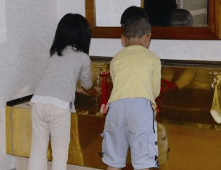 Children at Antimicrobial Copper hand-washing station
